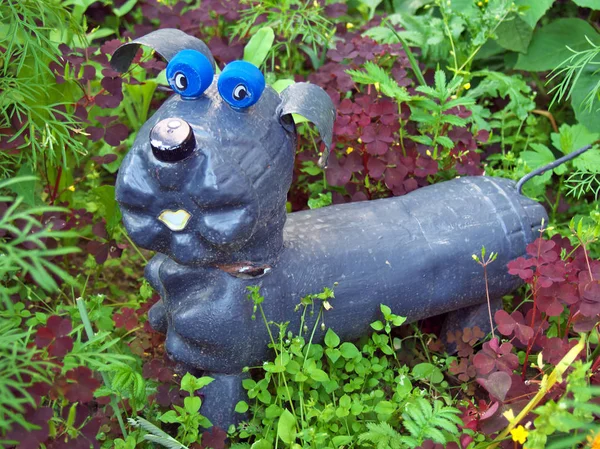 Dog made from old used plastic bottles