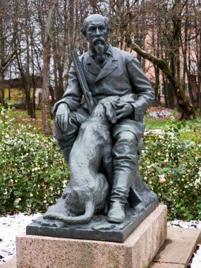 Chudovo, Russia - October 31, 2018: Monument to Nekrasov and his hunting dog, N.A. Nekrasov, Chudovo Novgorod region clipart