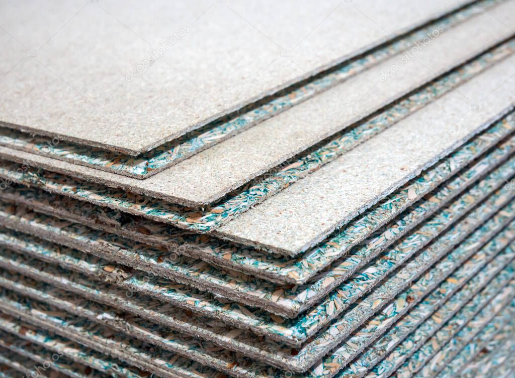 A stack of tongue-and-groove moisture resistant particle board