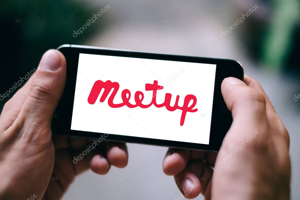 Closeup of smartphone screen with MEETUP LOGO and ICON