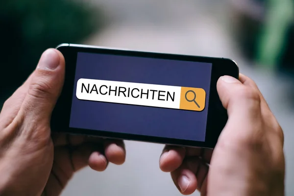 Almanca kelime Nachrichten yakın yukarı akıllı telefonda arama çubuğunda görüntülenir