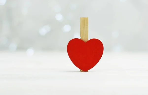 Red heart. holiday symbol of love Valentine\'s Day. Background blur bokeh illumination