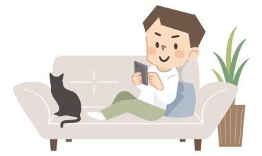 Kanepede akıllı telefon kullanan genç adam.