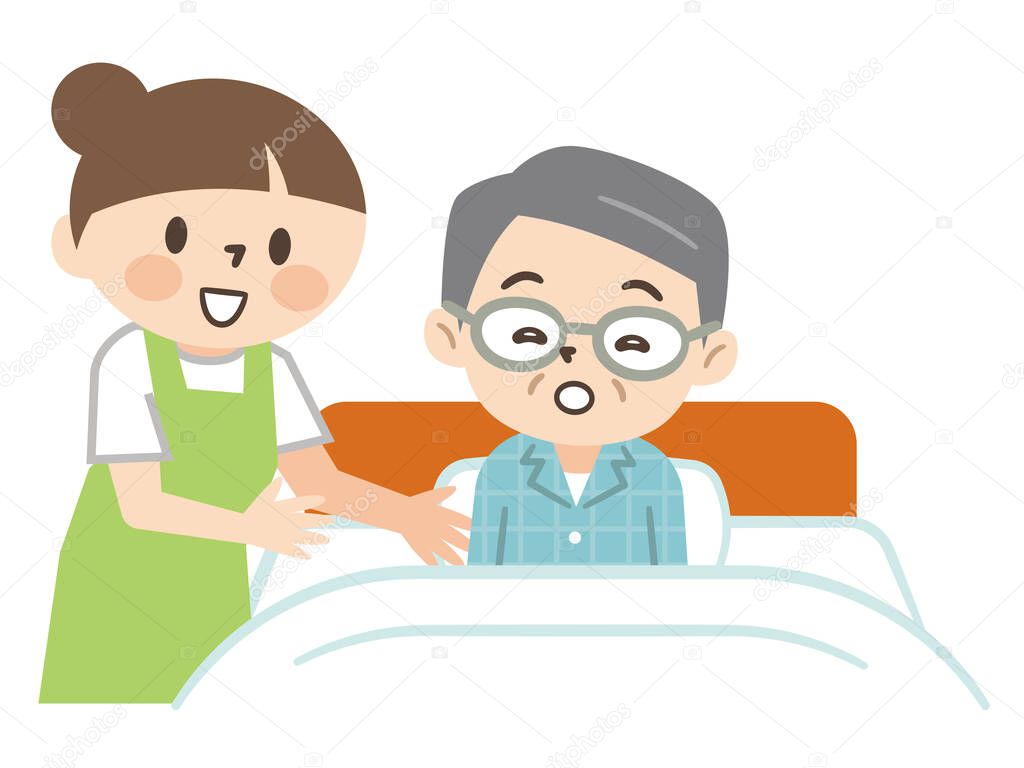 Young caregiver helping a senior man to sleep in bed