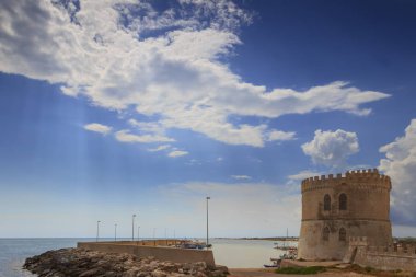 Torre Vado takes the name from the  watchtower which stands a few metres away from the sea shore, over tourist port. It's characterised by a low and rocky cliff, which alternates with a short beach. clipart