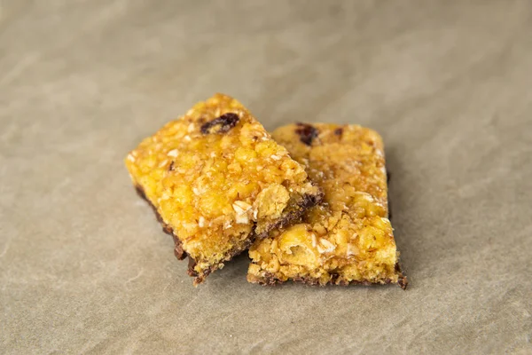 Muesli and cereal bar on marble stone background