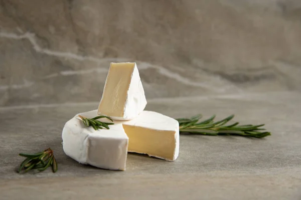 Cheese camembert or brie with fresh rosemary — Stock Photo, Image