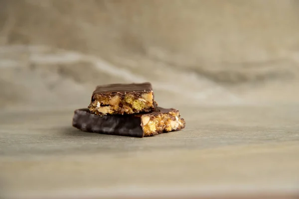 Muesli and cereal bar on marble stone background