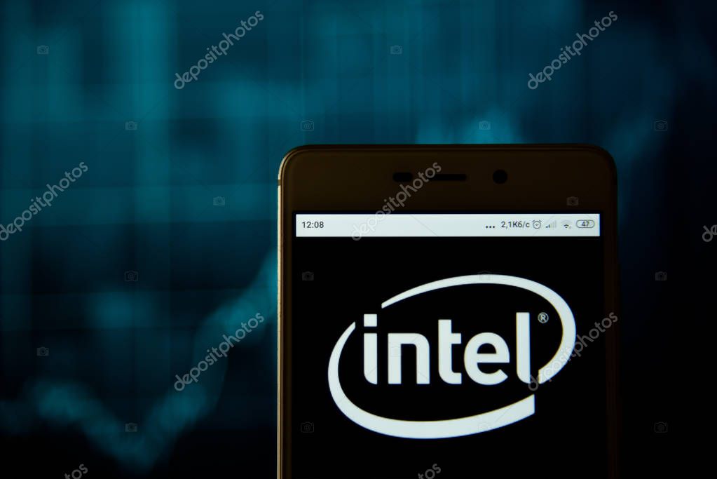 Ivano-Frankivsk, Ukraine - May 13, 2019:  Intel logo is seen on an smartphone over stock chart.   Intel logo is displayed on the screen of a mobile device.