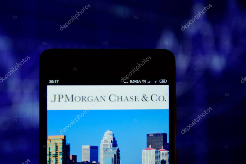 Ivano-Frankivsk, Ukraine - May 22, 2019: JPMorgan Chase logo is seen on an smartphone over stock chart. JPMorgan Chase logo is displayed on the screen of a mobile device.