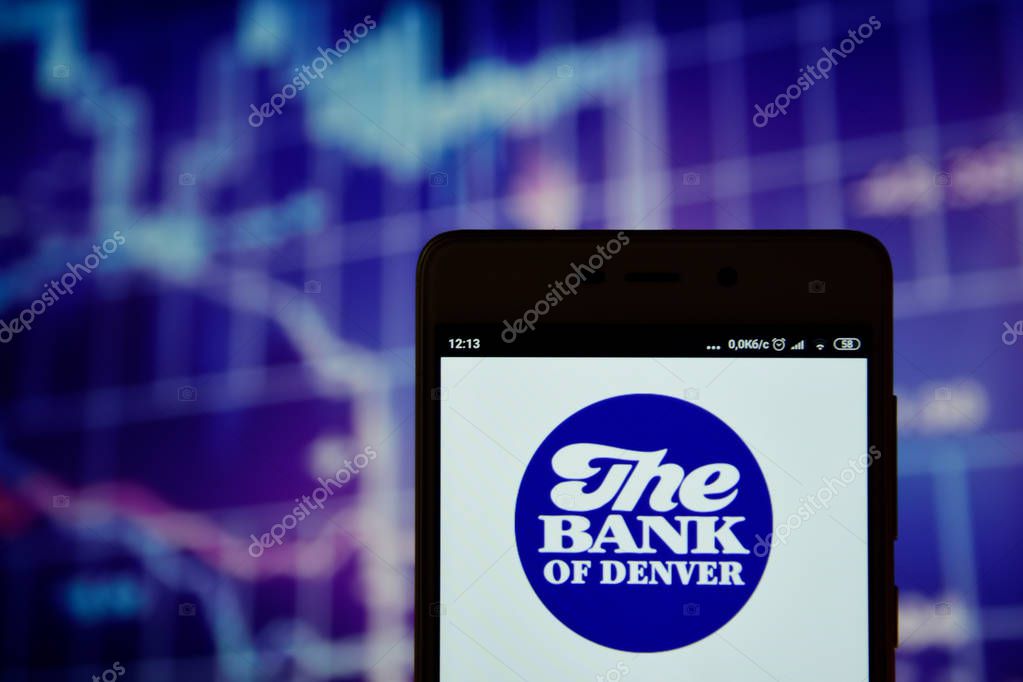 Ivano-Frankivsk, Ukraine - May 16, 2019:  The Bank of Denver logo is seen on an smartphone over over stock chart. The Bank of Denver logo is displayed on the screen of a mobile device.