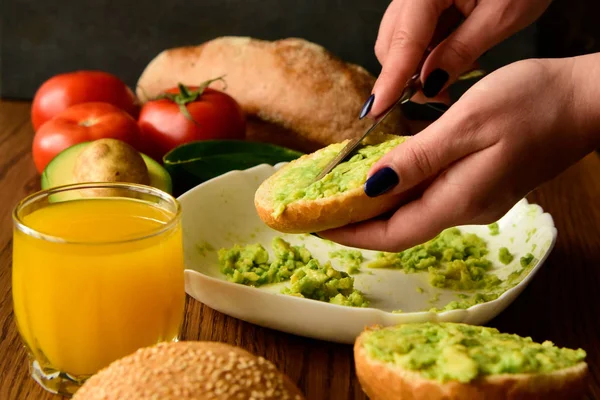 Making avocado toast on the home kitchen