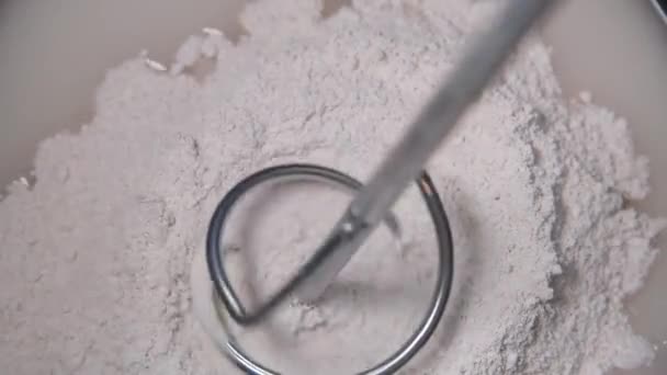 Slow motion pan shot of mixing concrete plaster — Stock Video
