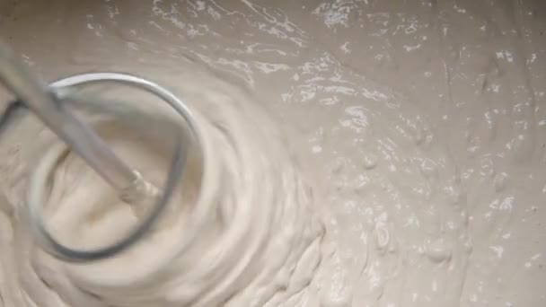 Slow motion pan shot of mixing concrete plaster — Stock Video