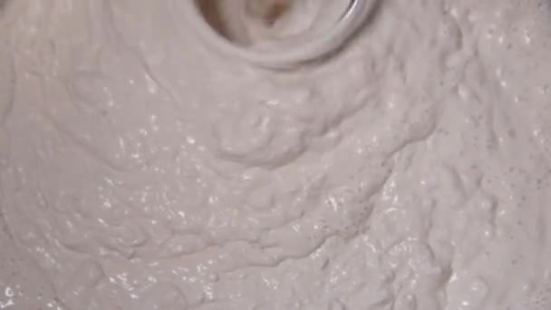 Slow motion pan shot of mixing concrete plaster — Stock Video