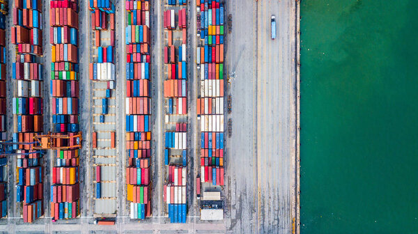 Aerial top view stack of freight container in rows, Container in import export business and logistic and transportation.