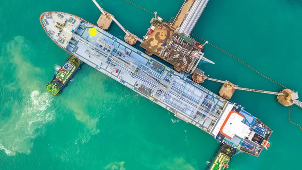 Tanker ship loading in port view from above, Tanker ship logistic import export business and transportation, Aerial view.