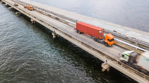 Aerial view truck speeding through a bridge, motion blur.