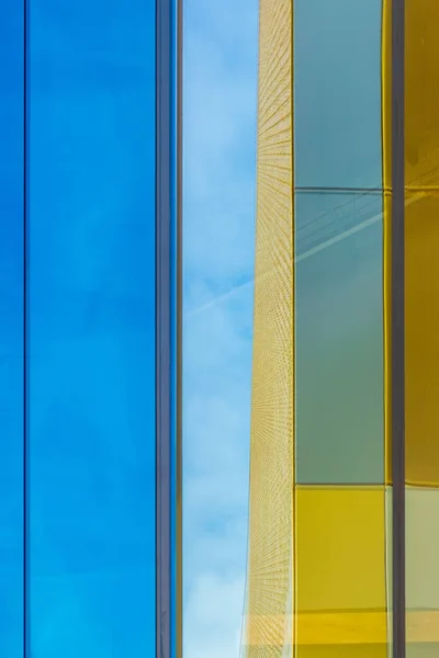 Contrasting colors and reflections on a building facade in the city center of Manchester, UK