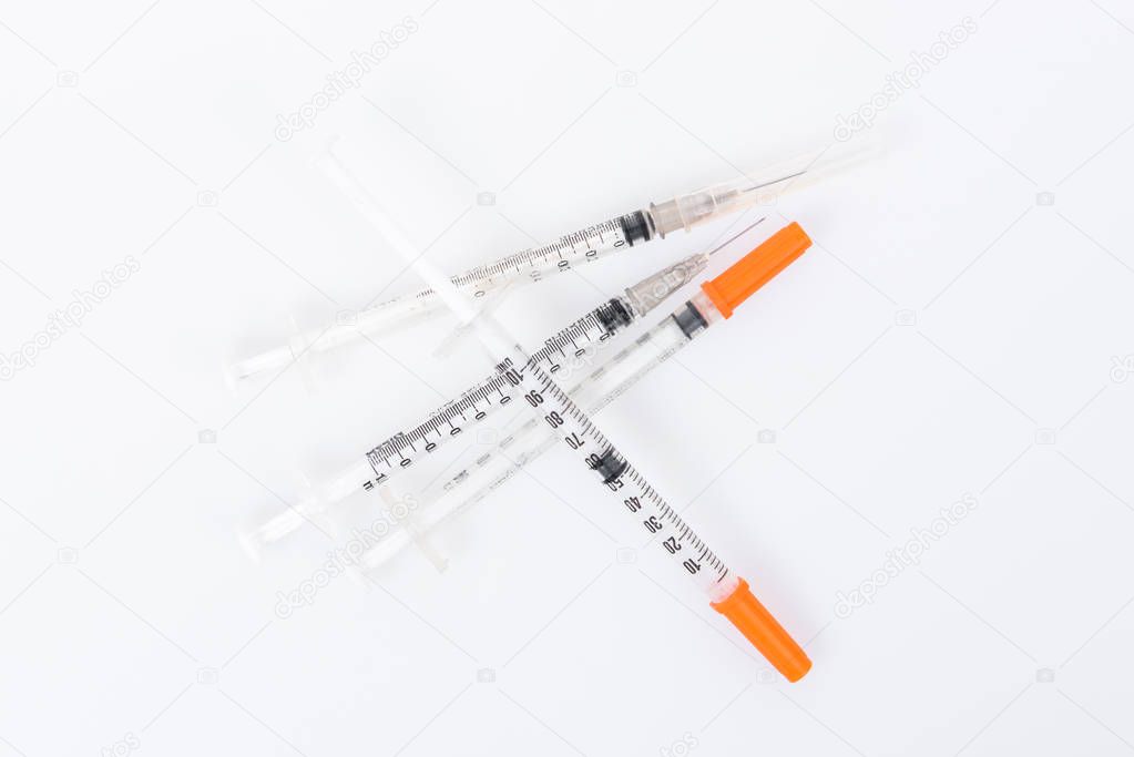 Empty medical syringe (needle) on white background