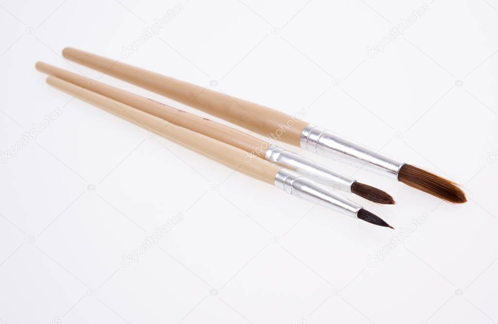 Painting brushes. Drawing tools, paint brushes on white background, copy space, top view