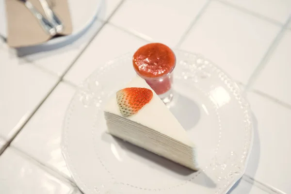 Strawberry Cheesecake : Delicious homemade cheesecake with strawberries on white table , selective focus