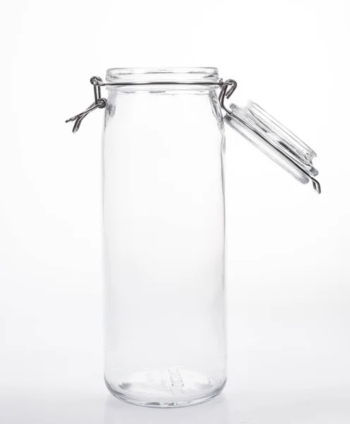 Frasco de vidro com tampa sobre fundo branco — Fotografia de Stock