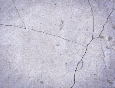 Çatlaklar, tam kare bir gri çimento duvar parçası