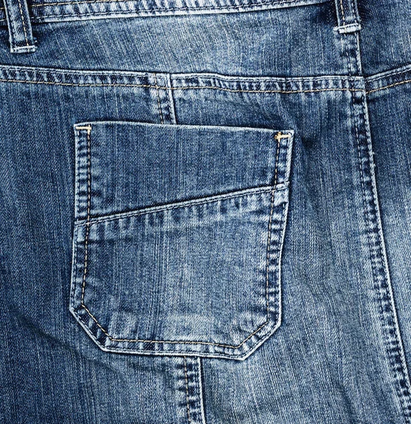 蓝色纺织品牛仔裤的片段与后面口袋 全框架 — 图库照片