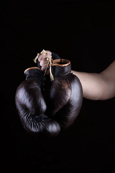 Man Hand Holds Pair Old Leather Brown Boxing Gloves Black — Stock Photo, Image