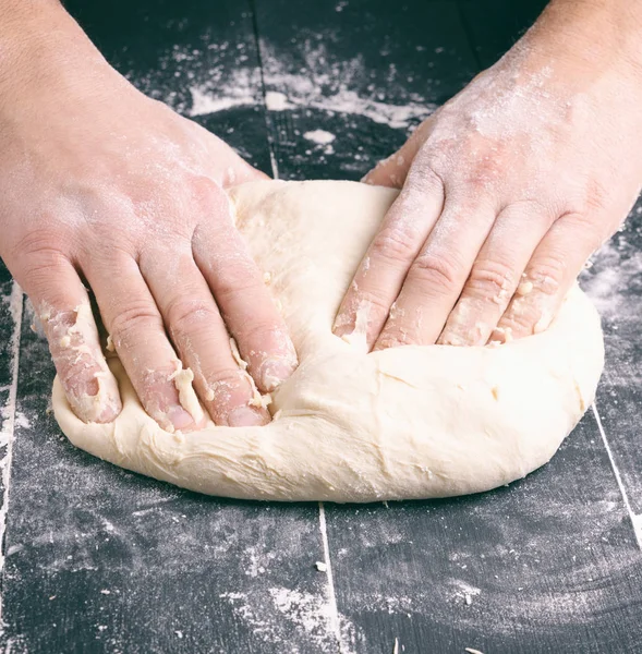 Male Hands Substitute White Wheat Flour Dough Black Wooden Background — Stock Photo, Image