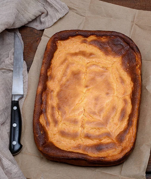 whole rectangular pie of cottage cheese and pumpkin , top view