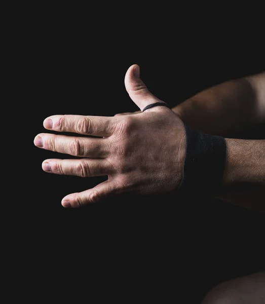 Man Wraps His Hands Black Textile Bandage Sports Black Background — Stock Photo, Image