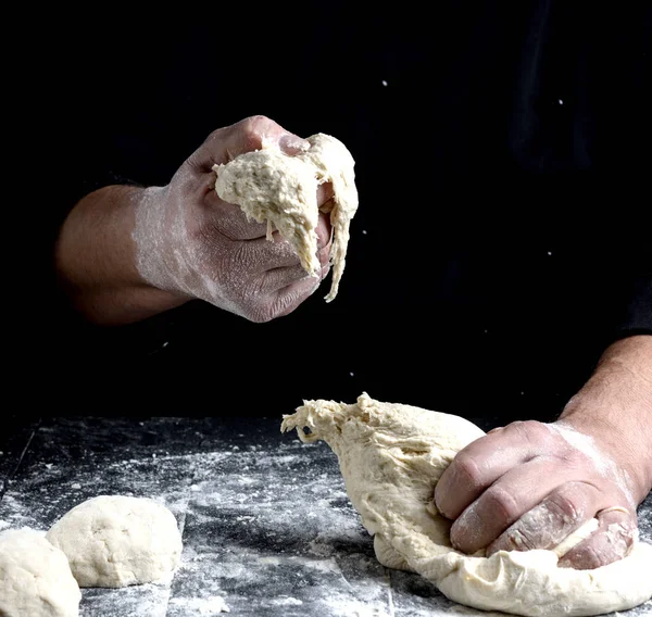 Male Hands Substitute White Wheat Flour Dough Black Wooden Background — Stock Photo, Image