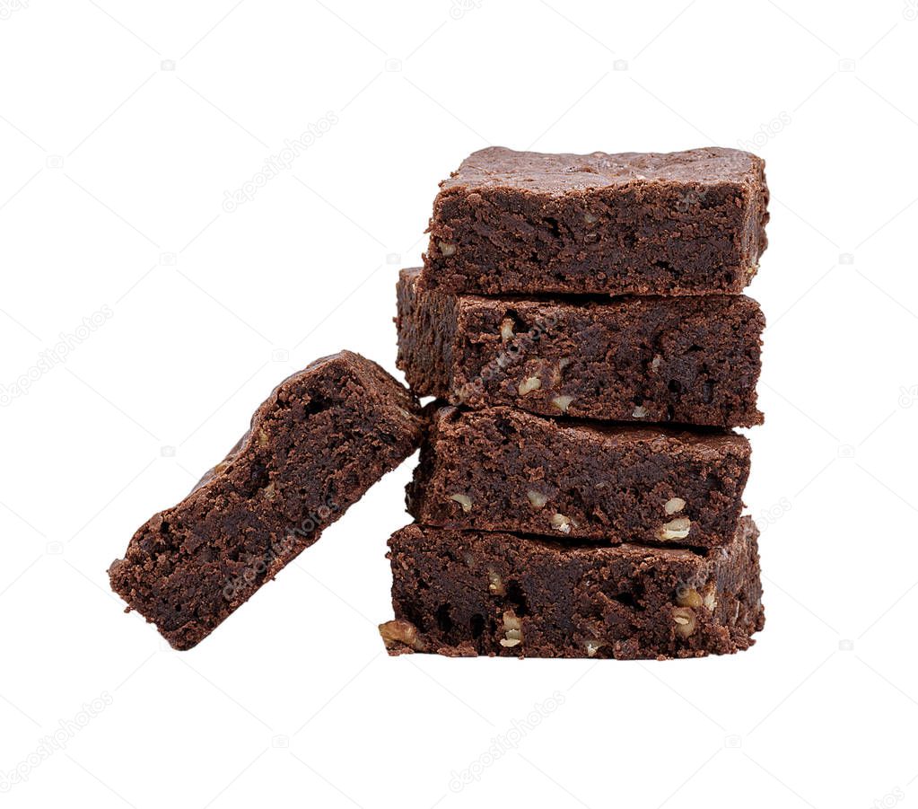 stack of square baked pieces of chocolate brownie pie with walnuts isolated on a white background