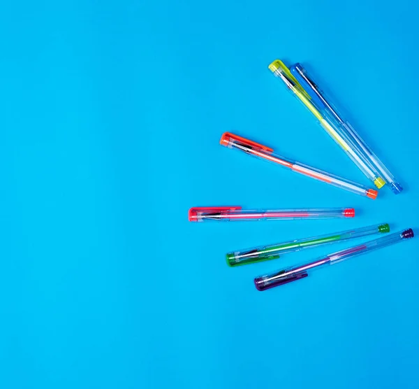 Many Multi Colored Gel Pens Blue Background Copy Space — Stock Photo, Image