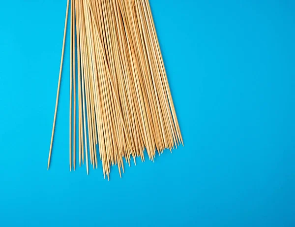 Wooden bamboo chopsticks on a blue background — 스톡 사진