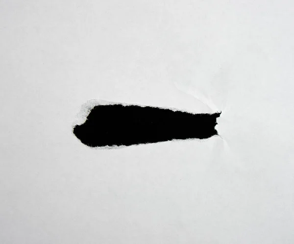 White sheet of paper with a hole, full frame — Stock Photo, Image