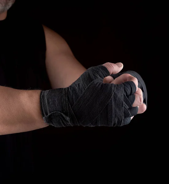 Two men's hands wrapped in black sports textile bandage — Stock Photo, Image