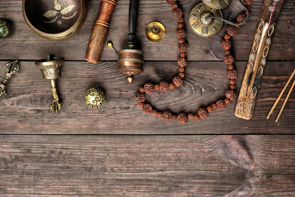 Copper singing bowl, prayer beads, prayer drum and other Tibetan