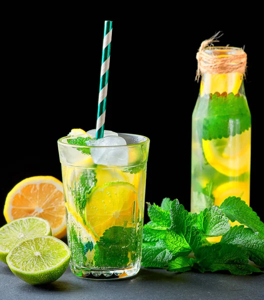 refreshing drink lemonade with lemons, mint leaves, ice cubes an