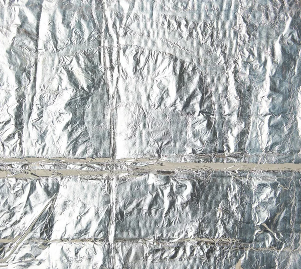 crumpled silver foil sheet, full frame