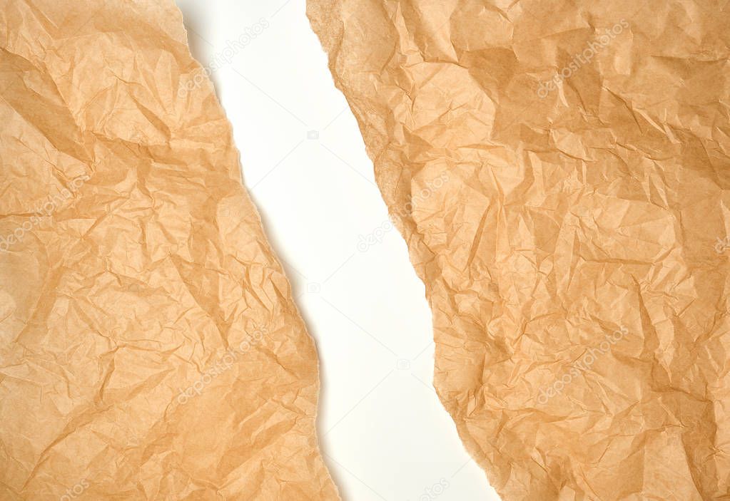 torn crumpled brown parchment paper, white background