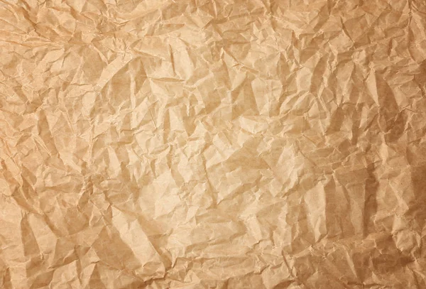 Zmačkaný hnědý pergamenový papír, plný rám — Stock fotografie