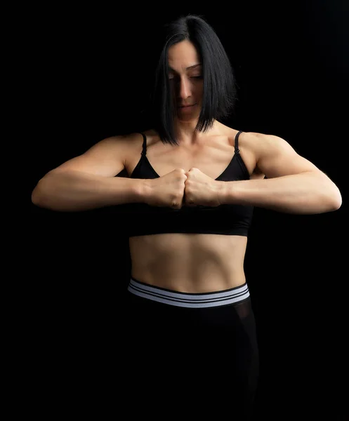 Beautiful girl with black hair, athletic appearance, fists in fr — Stock Photo, Image