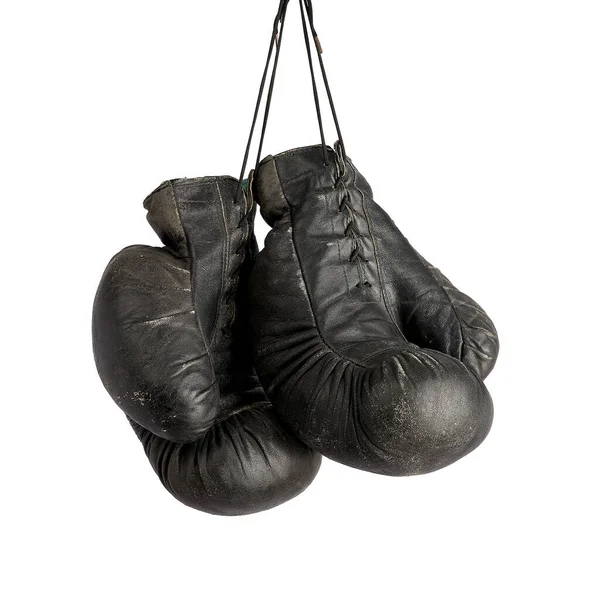 Pair of very old vintage black leather boxing gloves hanging on — Stock Photo, Image