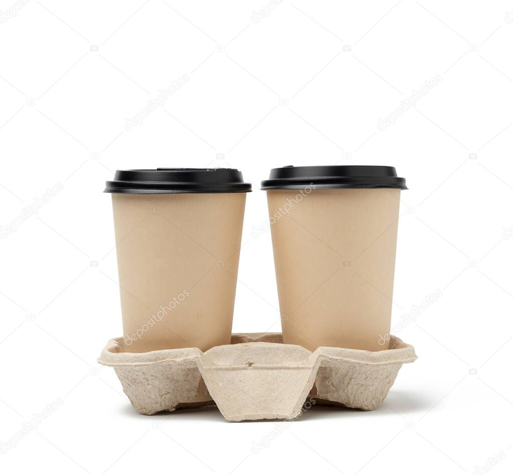 two brown paper disposable cups with a plastic lid stand in the tray, white background, takeaway containers