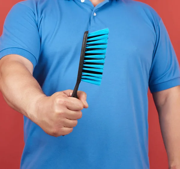 Man Blue Shirt Holds Plastic Brush Cleaning House Red Background — Stock Photo, Image
