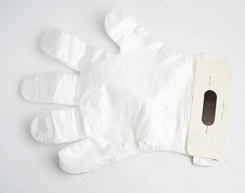 disposable polyethylene gloves on a white background, top view, flat lay