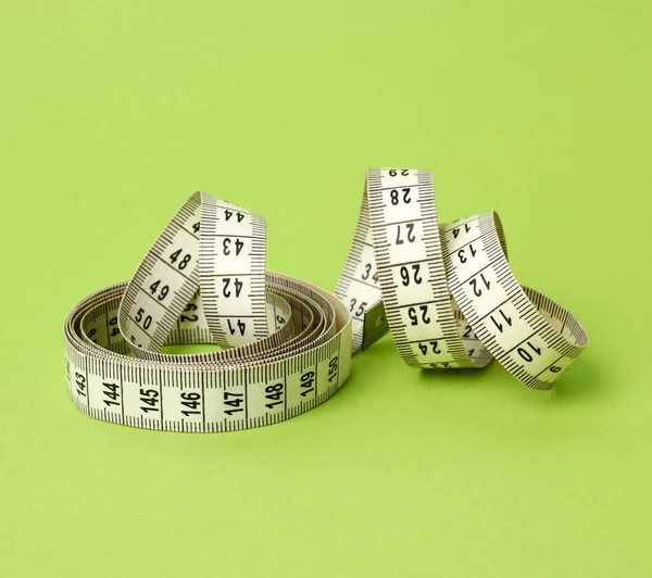 Twisted White Centimeter Green Background Close Measuring Tape — Stock Photo, Image